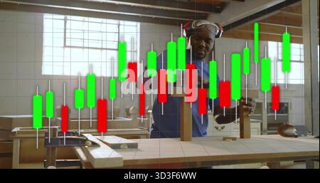 Measuring carpenter wearing protective gear using square on bench at woodshop, candlestick overlay Stock Photo
