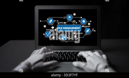 A robot interacts with a laptop displaying a digital interface focused on file management. The design showcases essential features like backup Stock Photo