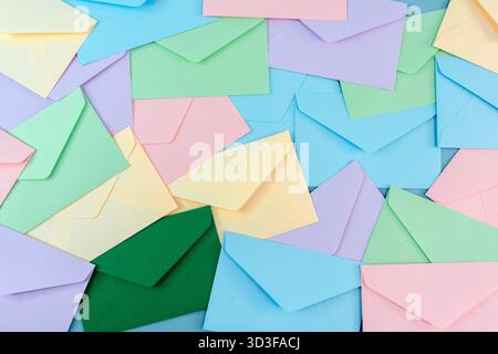 Multicolor envelopes on a blue background, a place for text, the concept of messages and subscriptions Stock Photo