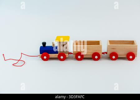 Wooden toy for children train, on isolated white background Stock Photo