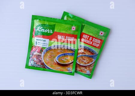 Kishoreganj, Bangladesh – October 15, 2024: Top view of Knorr Classic Thai Soup and Classic Hot and Sour Chicken Soup 28gm packets on a white surface. Stock Photo