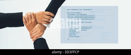 A powerful visual representation of teamwork, showcasing hands coming together over code in a modern workspace, symbolizing collaboration and unity in Stock Photo