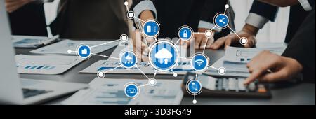 A dynamic office scene showcasing a team collaborating on cloud computing technology, working together on data analysis and innovative solutions in a Stock Photo
