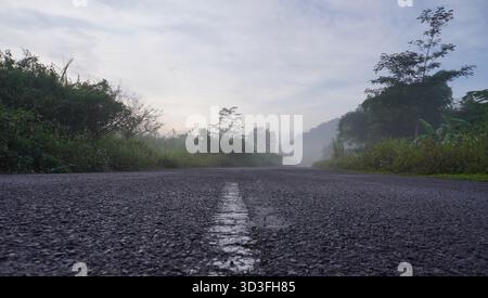 paved roads and mountains in the morning Stock Photo