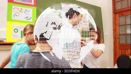 Pointing teacher wearing white button-up shirt guiding students at school, with colorful charts Stock Photo