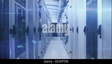Showing central aisle extending through data center equipment room, with server racks, cable trays Stock Photo