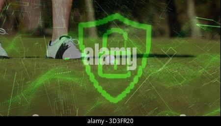 Displaying shield showing padlock hovering over golf ball on tee box with golf shoes, circuit grid Stock Photo