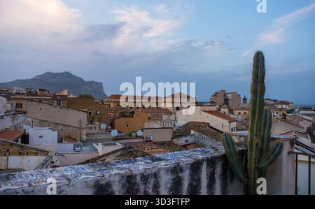 A panorama over the historic centre of Palermo in Sicily, Italy, taken from a rooftop in the Kalsa quarter at dusk. Buildings showing patina of time Stock Photo