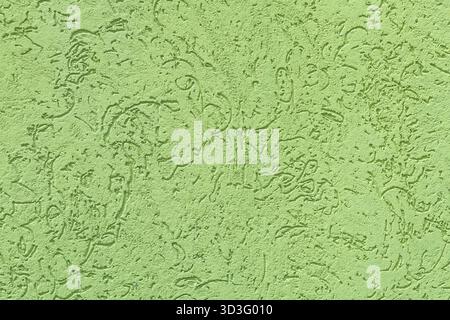 Close-up of a light green textured concrete wall, showcasing intricate patterns and rough surface detail. Ideal for backgrounds or architectural desig Stock Photo