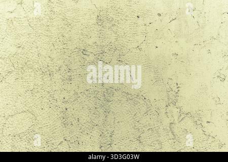 Close-up of a textured concrete wall showcasing intricate natural patterns and subtle tonal variations. Ideal for backgrounds or design projects needi Stock Photo