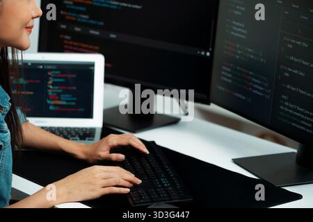 Cropped hands image of IT developer creating with typing information on pc with coding program information data website application, wearing jeans Stock Photo