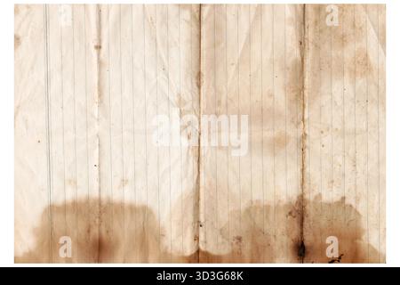 Vintage lined notebook paper sheet with brown stained spots isolated on white background. Aged lined rusted writing paper page Stock Photo