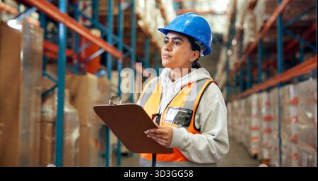 Logistics, thinking and woman with clipboard in warehouse, distribution and info for quality control. Factory, distributor and person with checklist Stock Photo