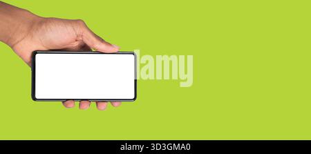 Hand presenting digital phone with empty display for online marketing, app launch or advertising layout. Stock Photo