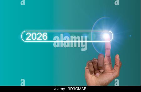 Hand touching digital search bar with year 2026. African American male showing futuristic interface symbolizing innovation, AI progress, virtual techn Stock Photo