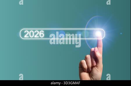 Hand touching virtual search bar with 2026 text. Female user interacting with futuristic digital interface symbolizing technology innovation, AI progr Stock Photo