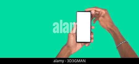 Holding smartphone with white display for digital campaign, advertising concept or promotional design. Stock Photo