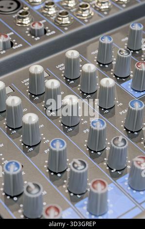 Generic audio mixing console, close up shot, abstract technology background Stock Photo