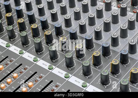Generic audio mixing console, close up shot, abstract technology background Stock Photo