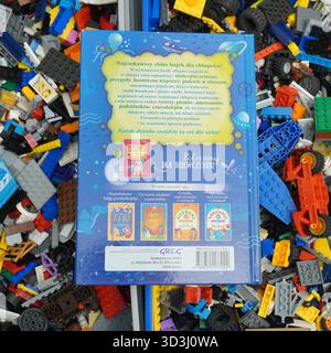A book laying on Lego bricks Stock Photo