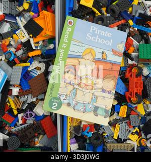A book laying on Lego bricks Stock Photo