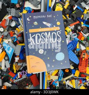 A book laying on Lego bricks Stock Photo