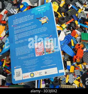 A book laying on Lego bricks Stock Photo