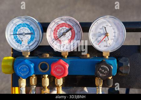 Manifold gauge set, pressure gauge. Maintenance and repair of refrigeration and air conditioning or HVAC system. Industrial equipment for measuring Stock Photo