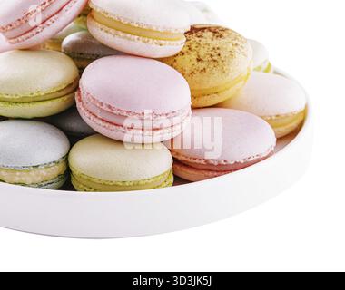 Food, Multicolored macaroons on ceramic plate isolated on white Stock Photo