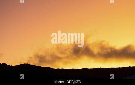 Cumulus and Stratus clouds in dramatic sunset sky over Cape Town Stock Photo