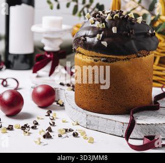 Food, Easter cakes with colored eggs on a wooden table Stock Photo