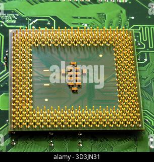 Macro Close up of microchips and pins on Main CPU PC processor circuit board Stock Photo