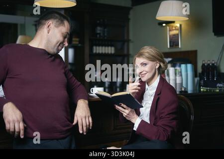 Business people talking over coffee in a cafe Stock Photo