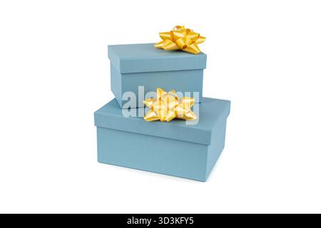 Two blue gift boxes with yellow ribbons on white background. Stock Photo