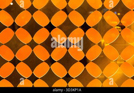 Yellow decorative translucent glass with a diamond pattern. Stock Photo