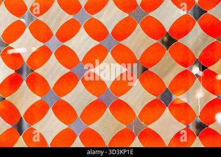 Orange decorative translucent glass with a diamond pattern. Stock Photo