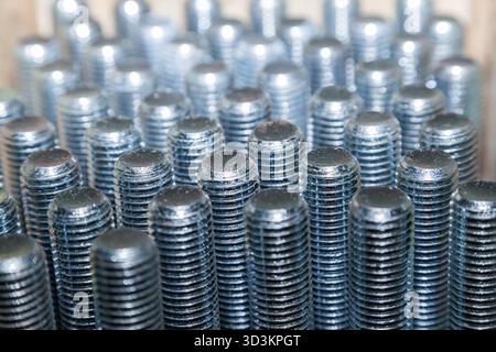 Lots of new galvanized steel bolts Stock Photo
