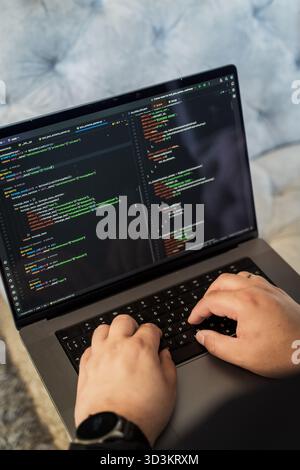Programming language concept. Programmer profession - writing programming code on laptop Stock Photo