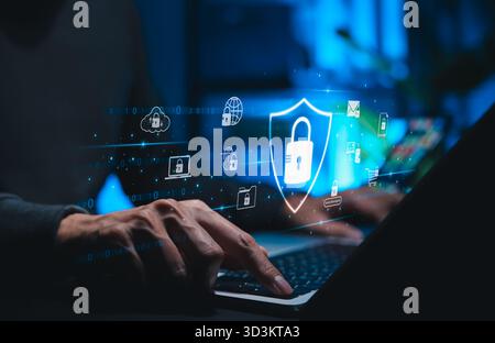 Cybersecurity and data protection concept. Person using laptop with padlock icon, representing secure online network, internet privacy, safe online Stock Photo