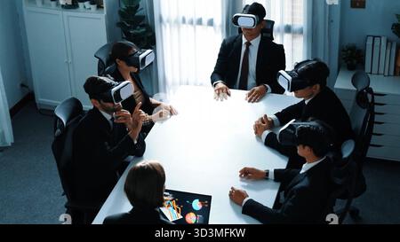 Top view of project manager working on laptop and sending data analysis to business people by using VR glass headset. Professional marketing team Stock Photo