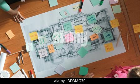 Top down view of smart business people shaking hands and making a contract. Aerial view of architect engineer working together and dealing plan or Stock Photo