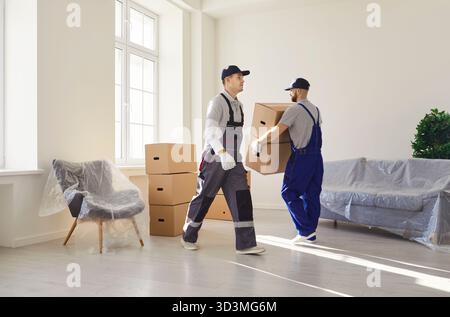 Movers Handling Boxes During Relocation Stock Photo