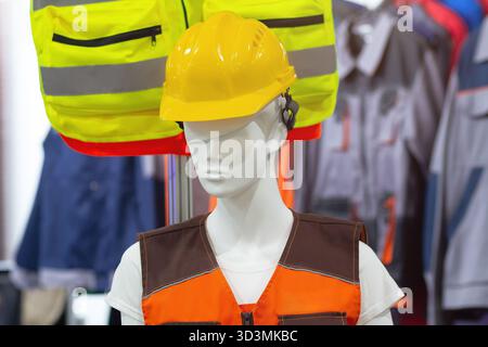 Mannequin in a protective helmet and working overalls. Industry Stock Photo
