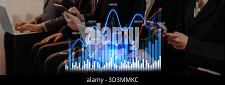 Business professionals engage in stock market analysis using smartphones while reviewing financial data in a modern office setting filled with graphs Stock Photo