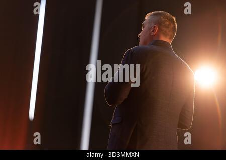Professional businessman giving presentation at conference hall Stock Photo