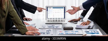 Panorama shot analyst team utilizing BI Fintech to analyze financial report with laptop. Businesspeople analyzing BI data dashboard displayed on Stock Photo
