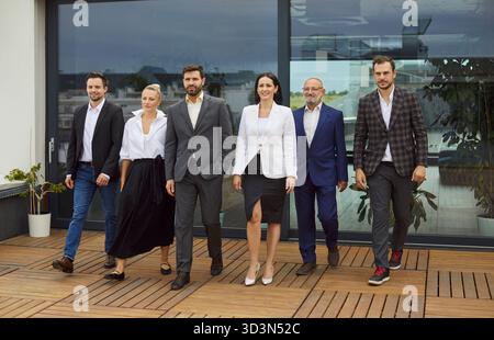 Business team walking together, corporate employees on outdoor meeting by office Stock Photo
