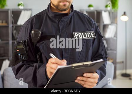 Cop Typing Police officer writing on a clipboard wearing a NYPD uniform Stock ...