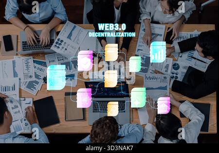 A collaborative workspace featuring a diverse team analyzing data and strategies related to Web3.0 and decentralization. Ideal for business and Stock Photo