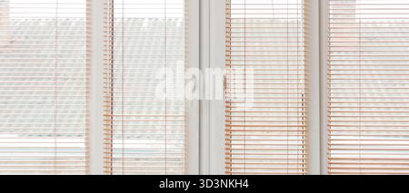 Big window with blinds in room Stock Photo